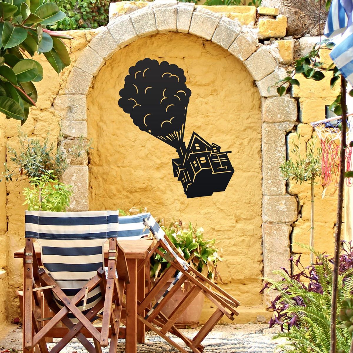 Floating House on Balloons Steel Wall Art on a Yellow Wall