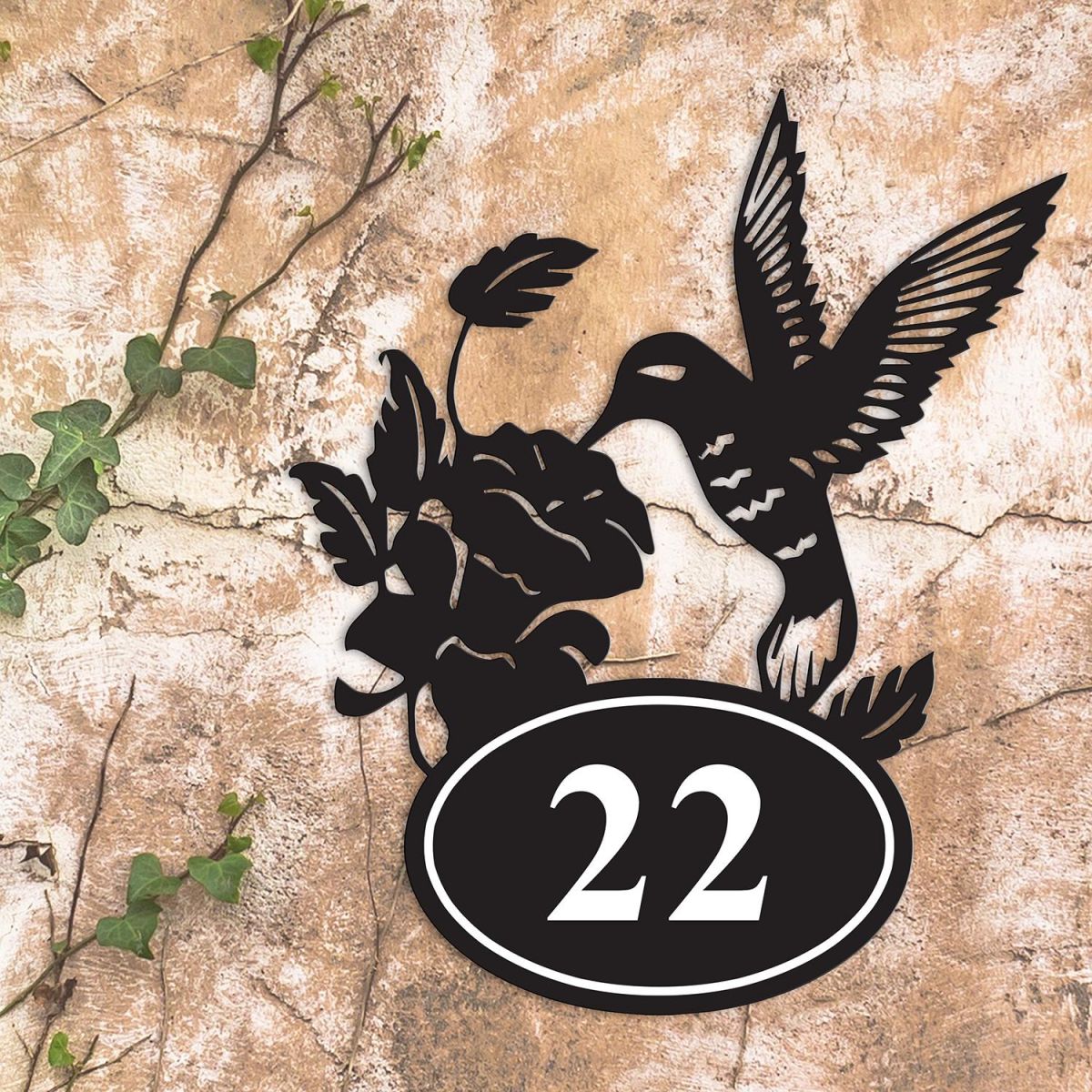 Hummingbird Iron House Number Sign in Situ on a Rustic Wall 