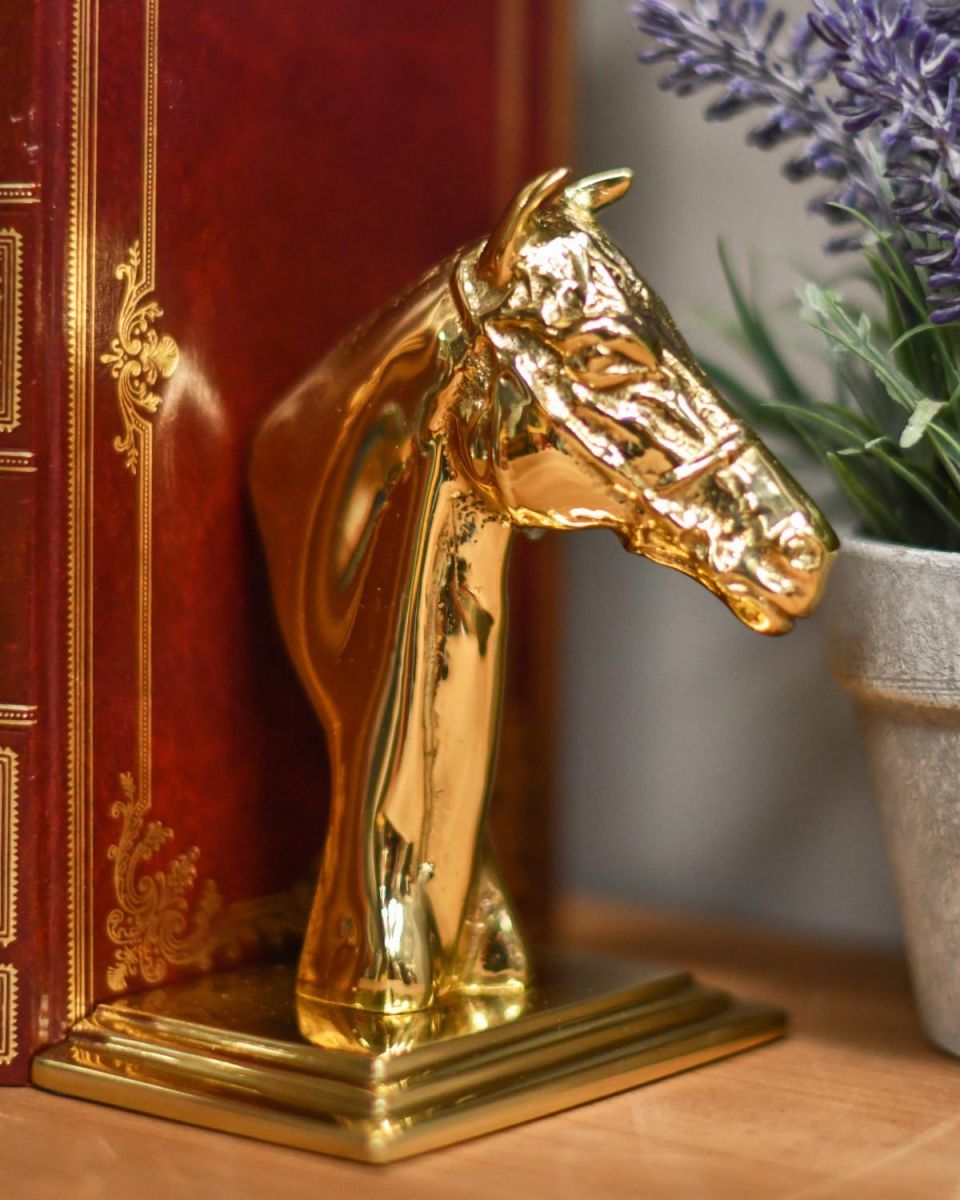 Individual Polished Brass Horse Head Bookend in Situ