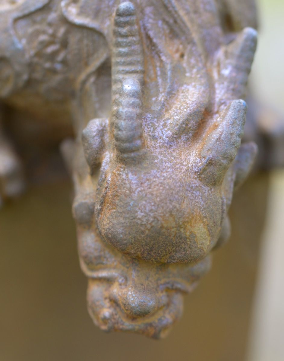 Close-up of Cast Iron Curious Dragon Sculpture