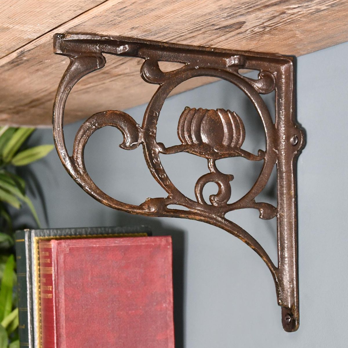 Iron Lotus Flower Shelf Bracket in Situ Holding up a Wooden shelf