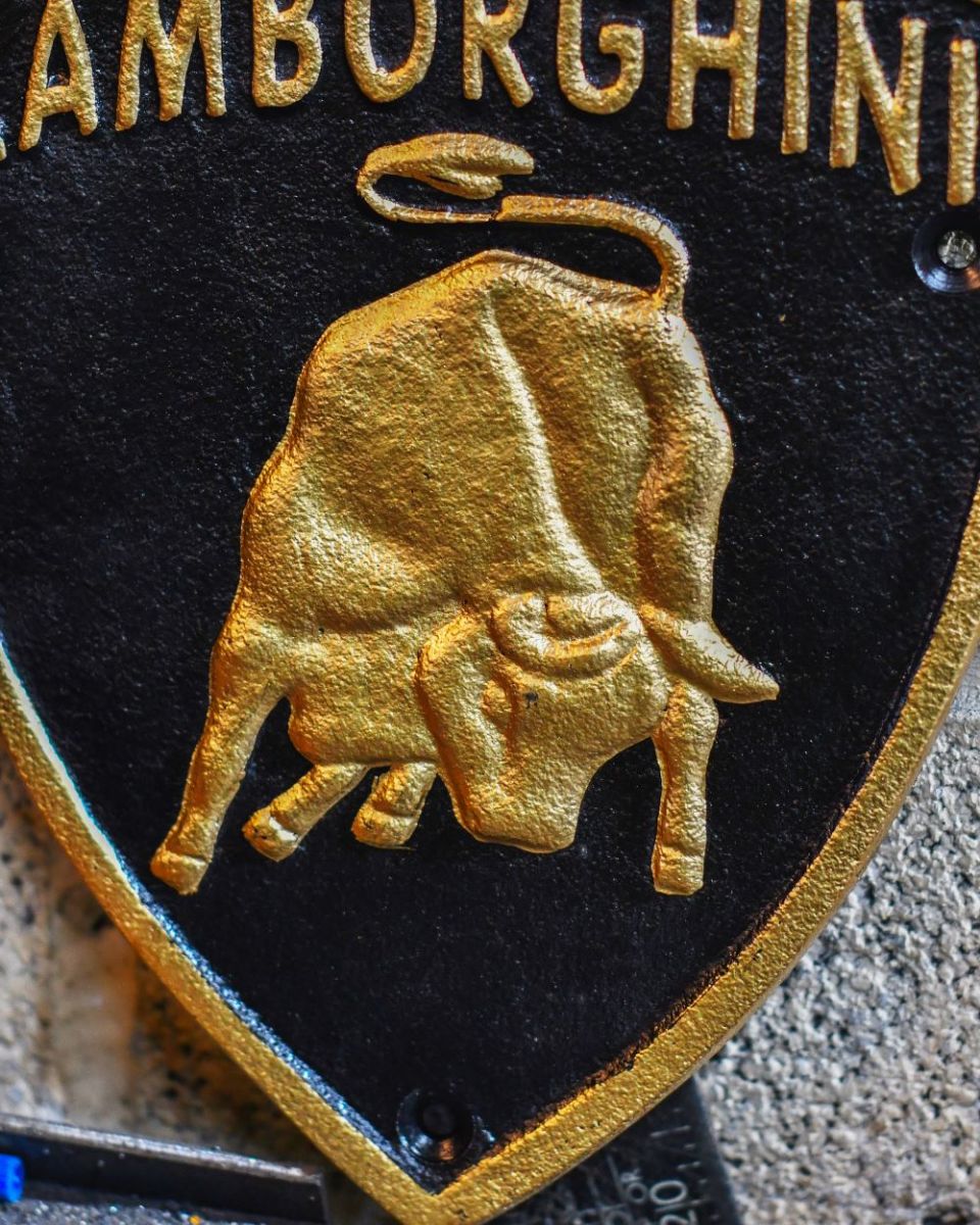 Close up of "Lamborghini" Cast Iron Automobilia Reproduction Sign finish