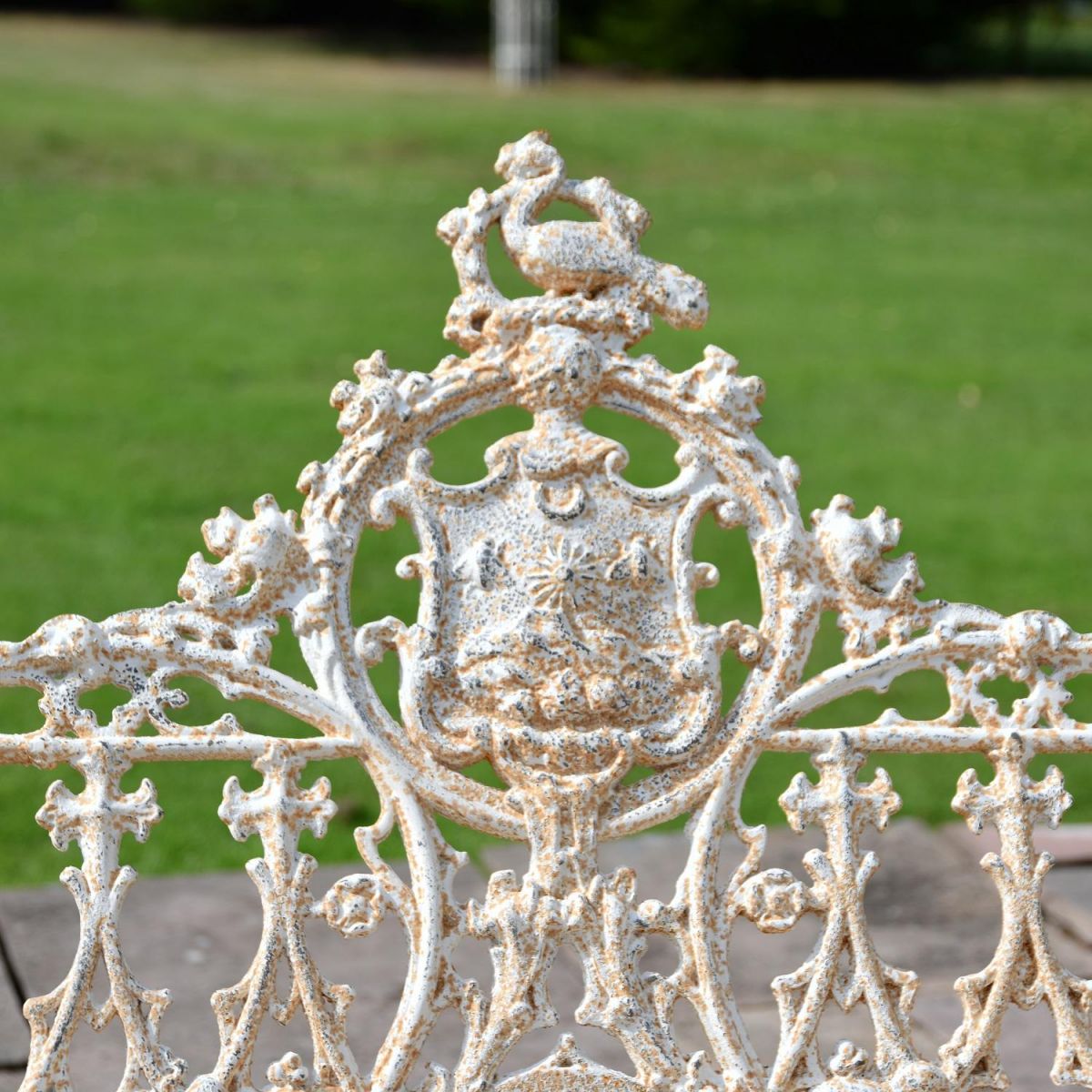 Close up of Central Gothic Motif on Antique Cream Cast Iron Garden Bench