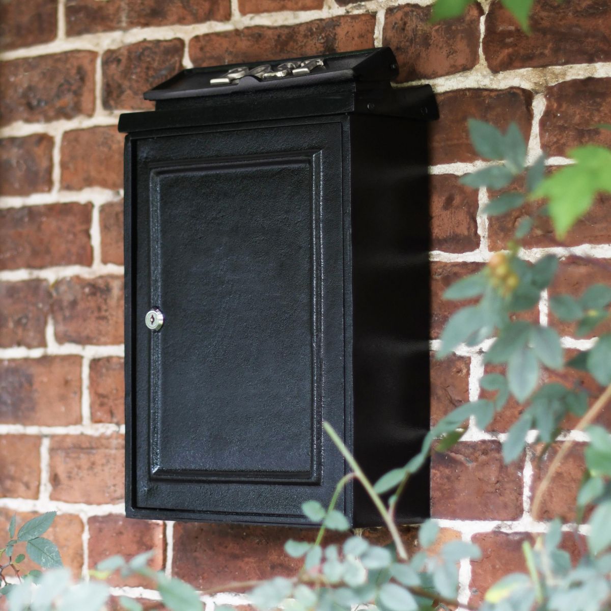 Simplistic Post box on brick wall