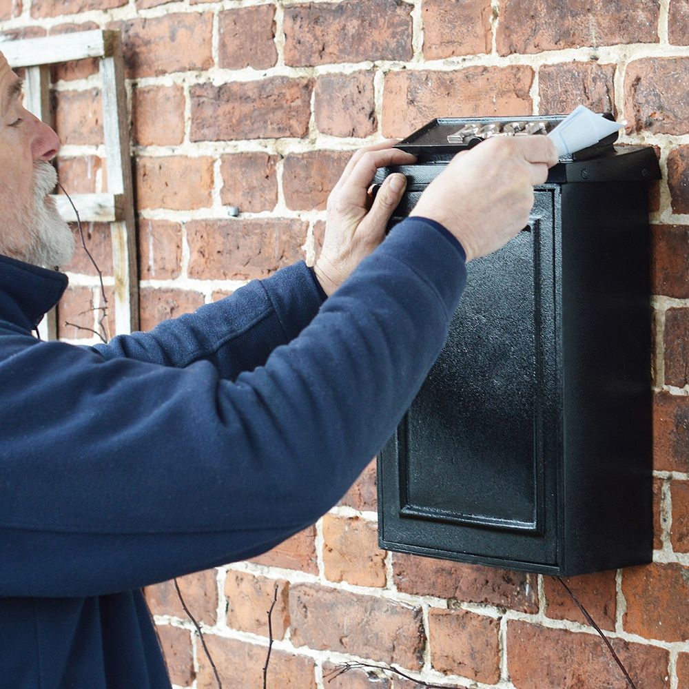 Bright Chrome Simplistic Post Box on wall