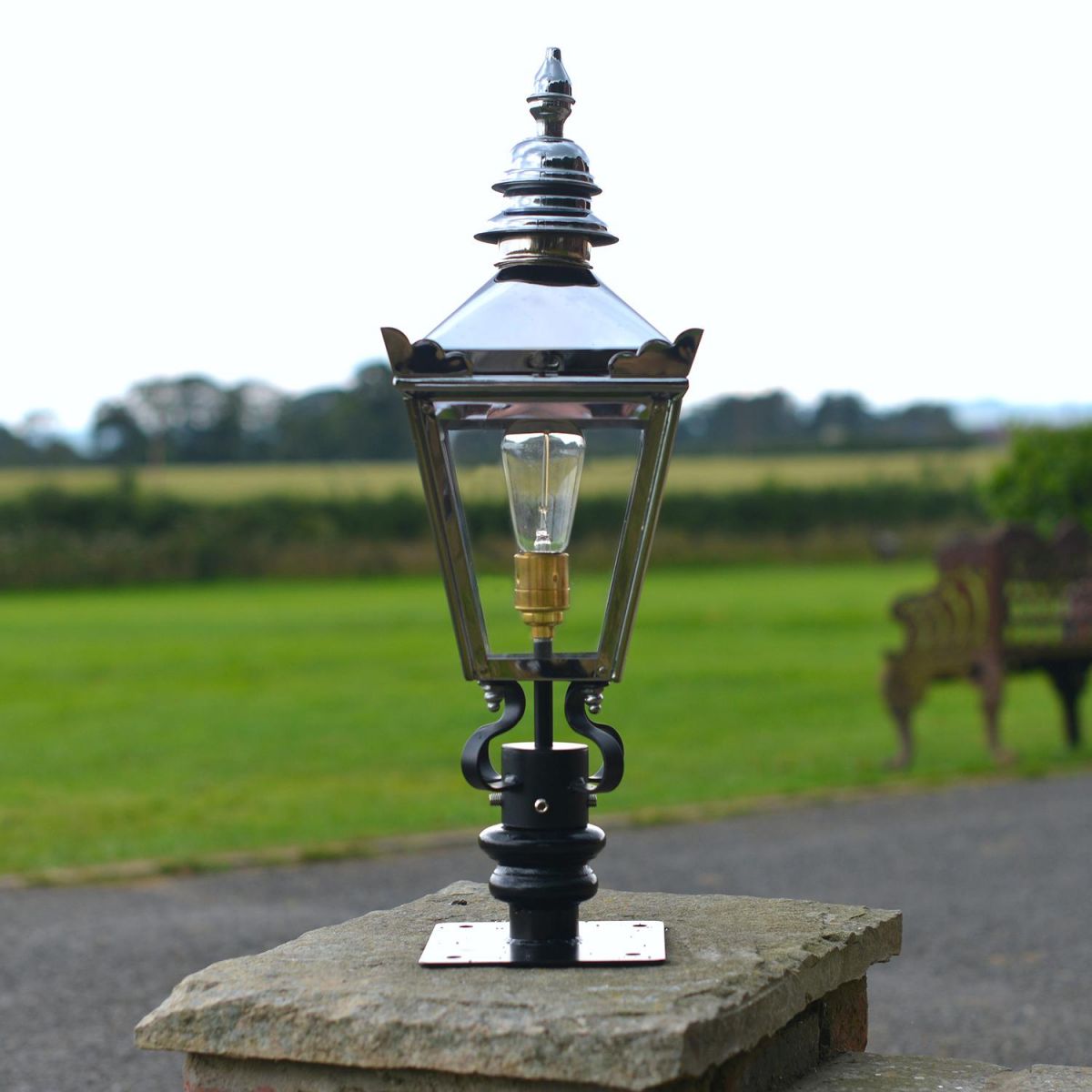 Bright Chrome Harrogate Pillar Light and Lantern Set in Situ on a Driveway
