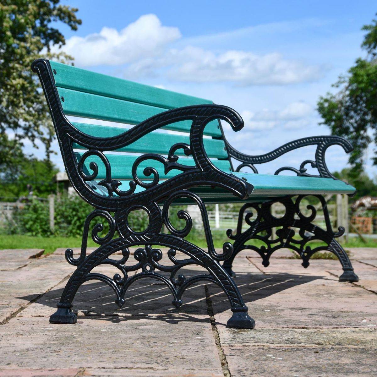 Close up of Cast Iron arms and legs with scroll filigree detailing