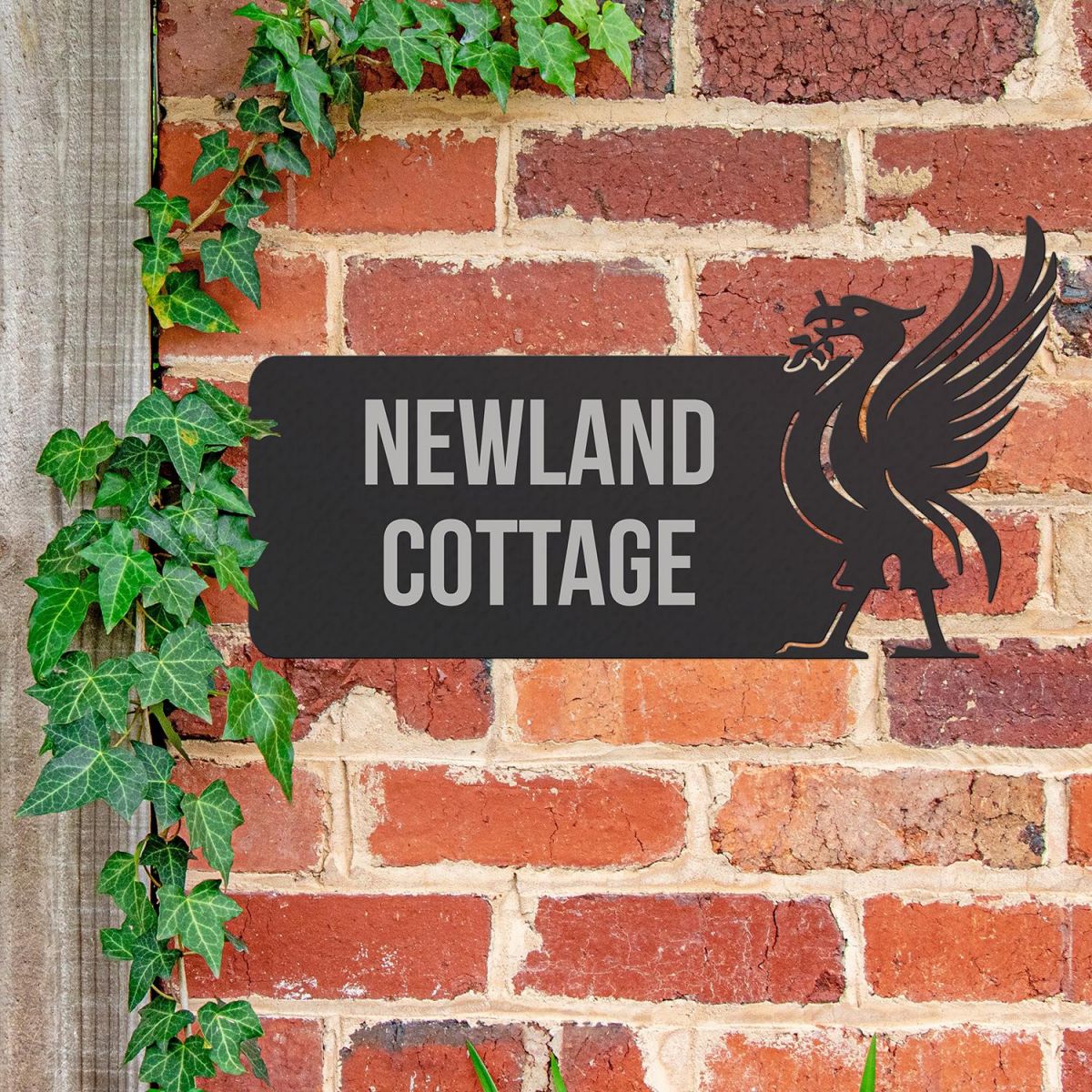 Liver Bird Iron House Name Sign in Use on a Brick Wall