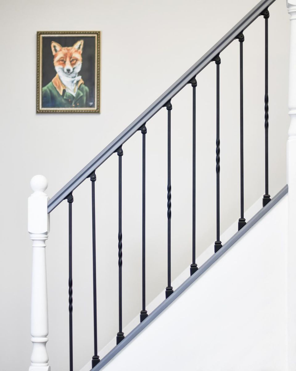 Set of 2 Matte Black Stair Spindles Being Used on Staircase
