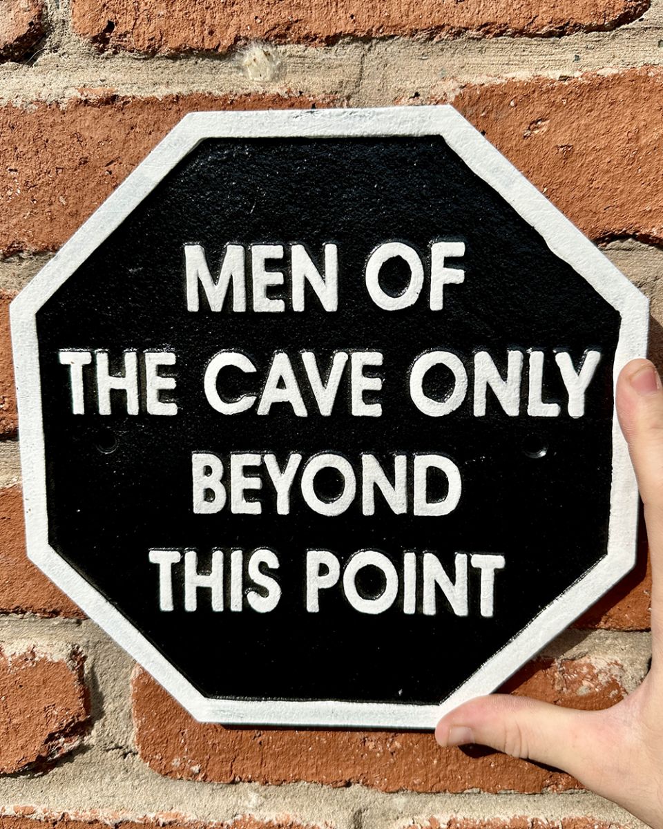 Cast Iron Men of the Cave Wall Sign