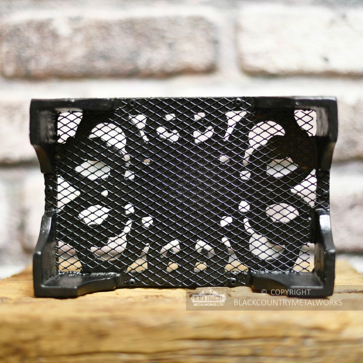Mesh backing on traditional cast iron wall air brick