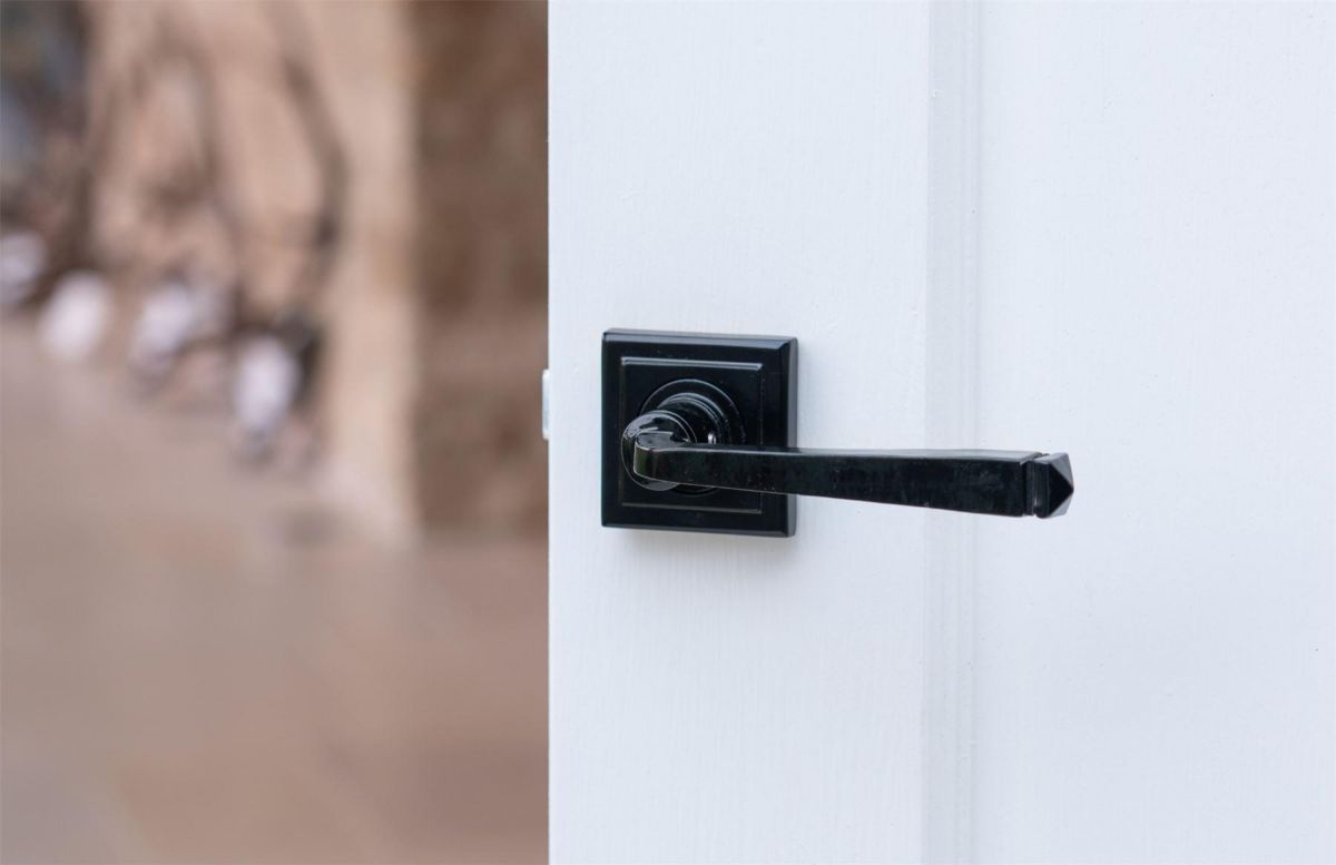 Midnight Black Lever Door Handle on Square Rose on Door