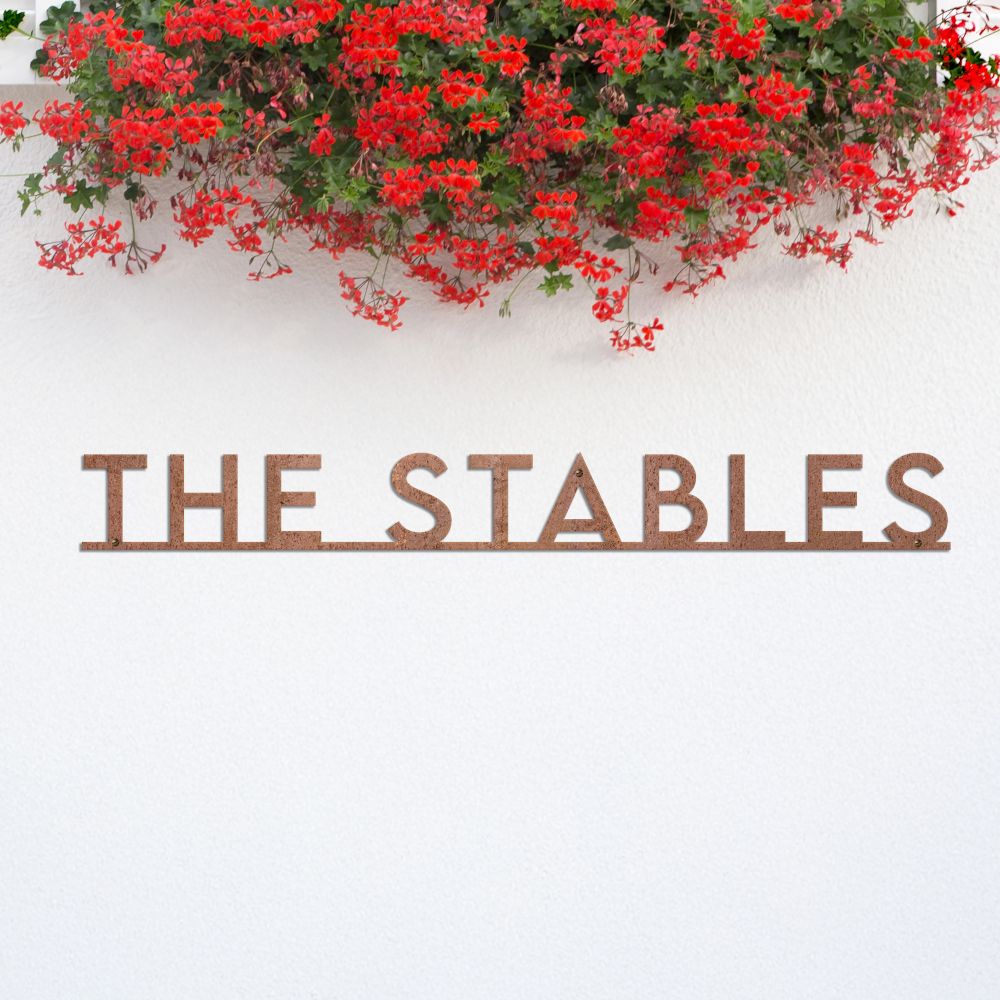 Minimalist Rustic House Name Sign under flowers