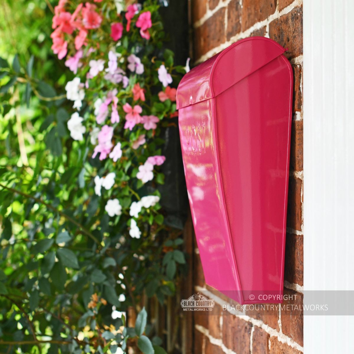 View of the Side of the “Persian Summer” Bright Pink Contemporary Post Box Mounted on a Wall