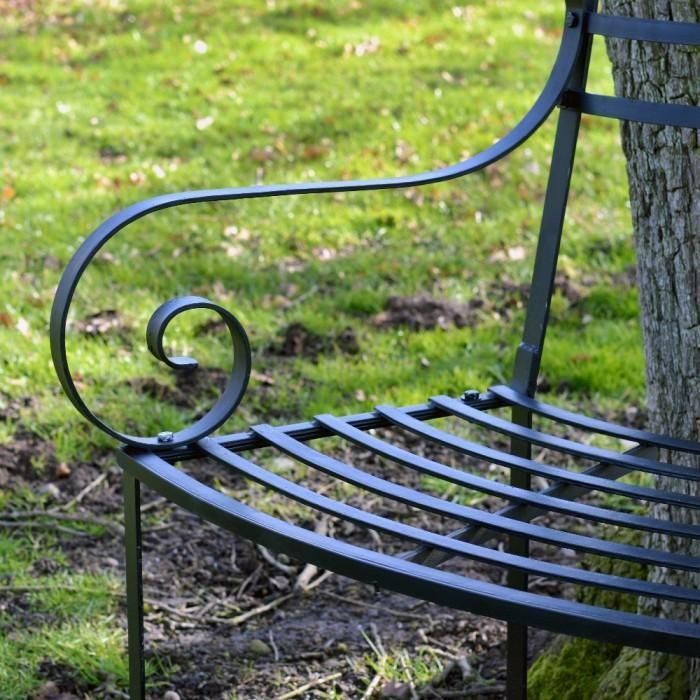 Close-up of the Ornate Scroll Arms on the Tree Seat