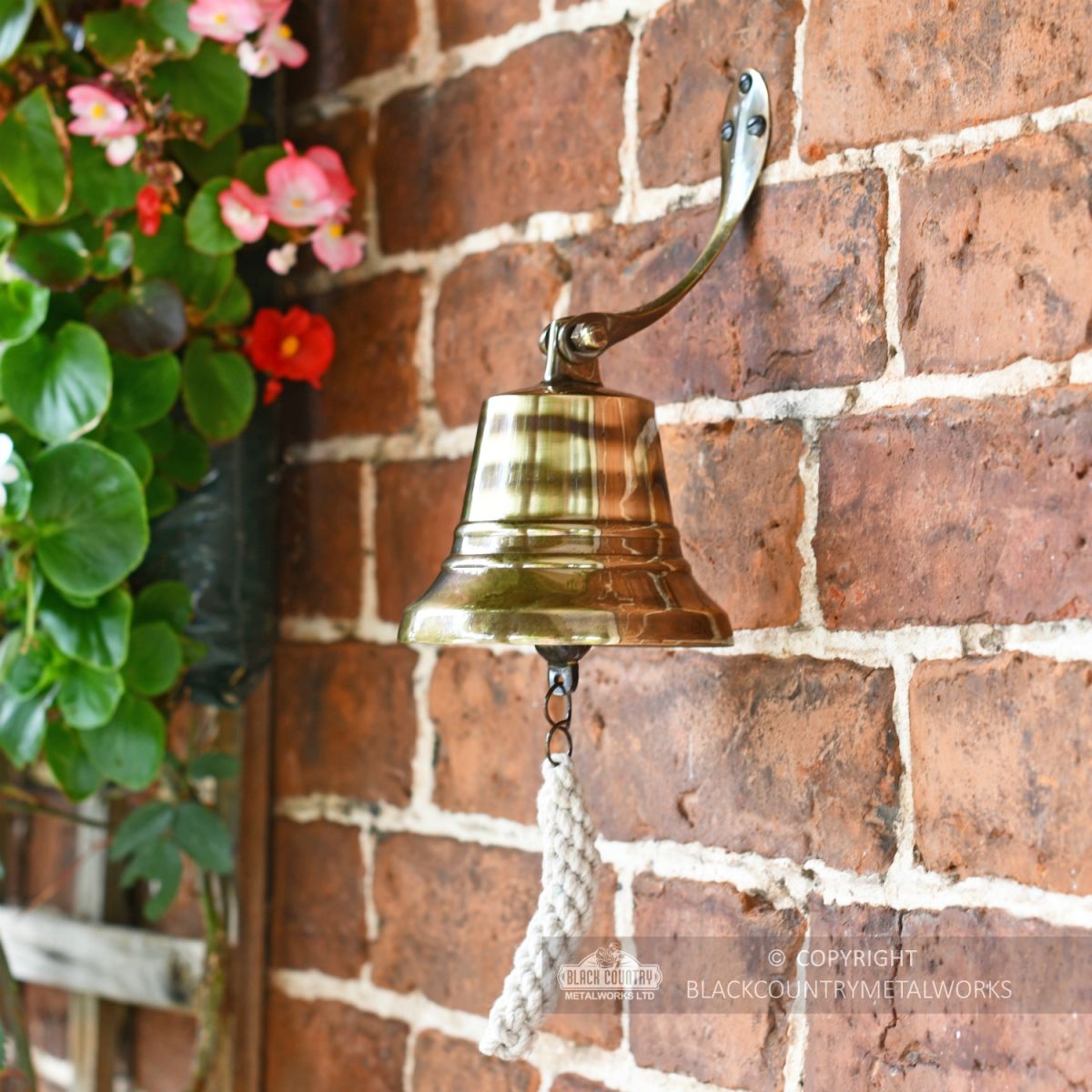 5" Antique Brass Bell with Rope Lanyard in Situ on a Brick Wall