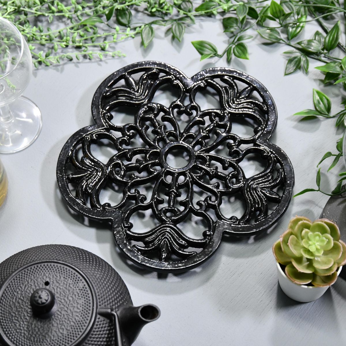 Black Cast Iron Flower Trivet in Situ with Teapot