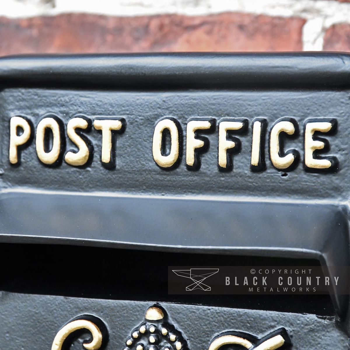 Close-up of the Embossed Post Office Text on the Post Box