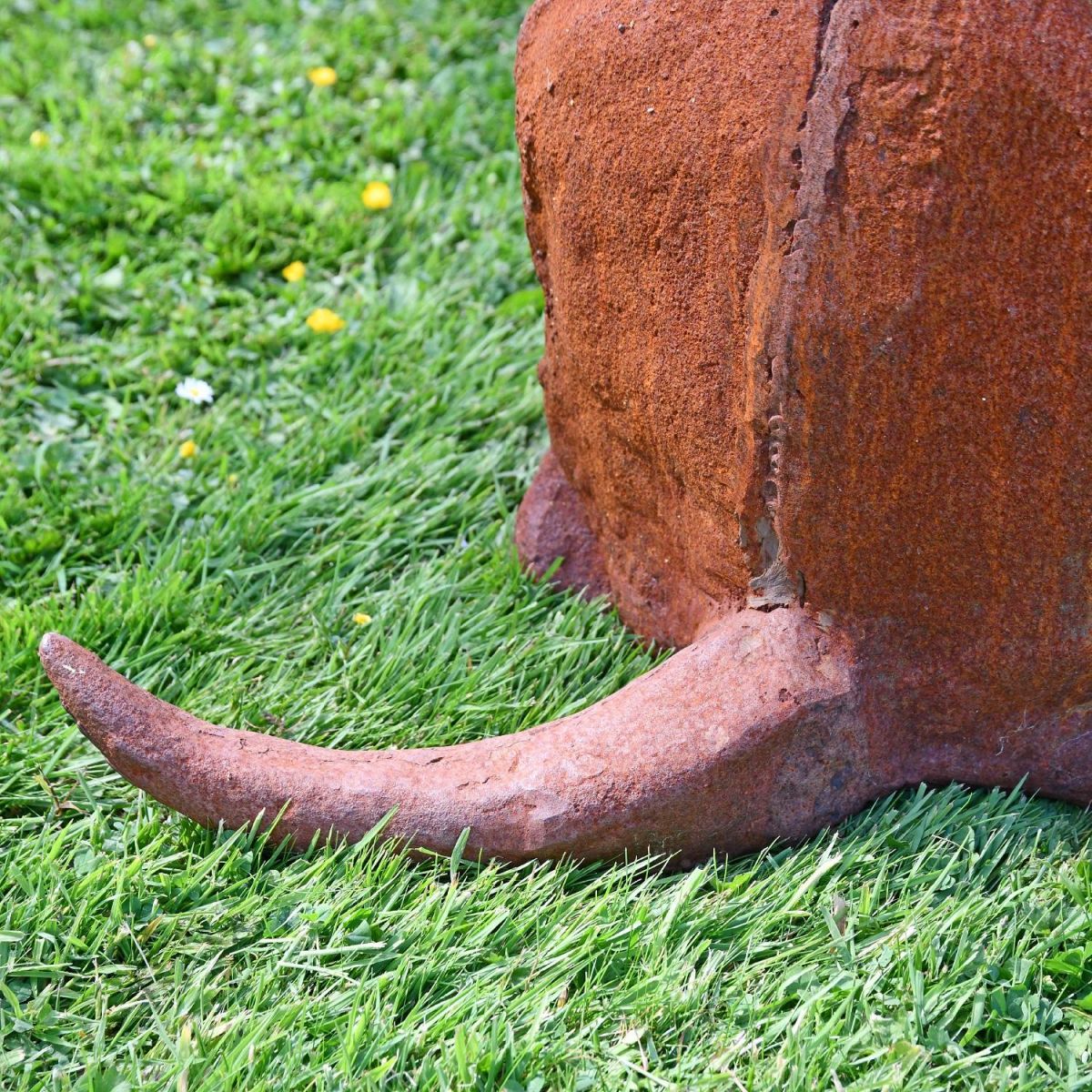 Close up of tail on dog sculpture 