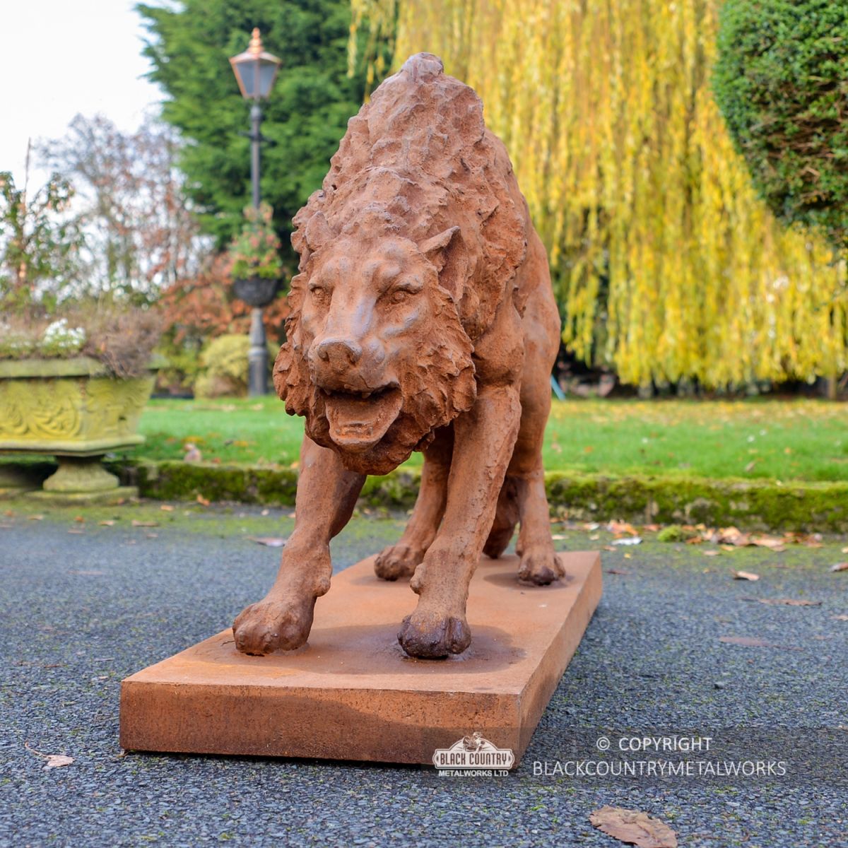 Wolf Sculpture with Arched Back Created From Cast Iron