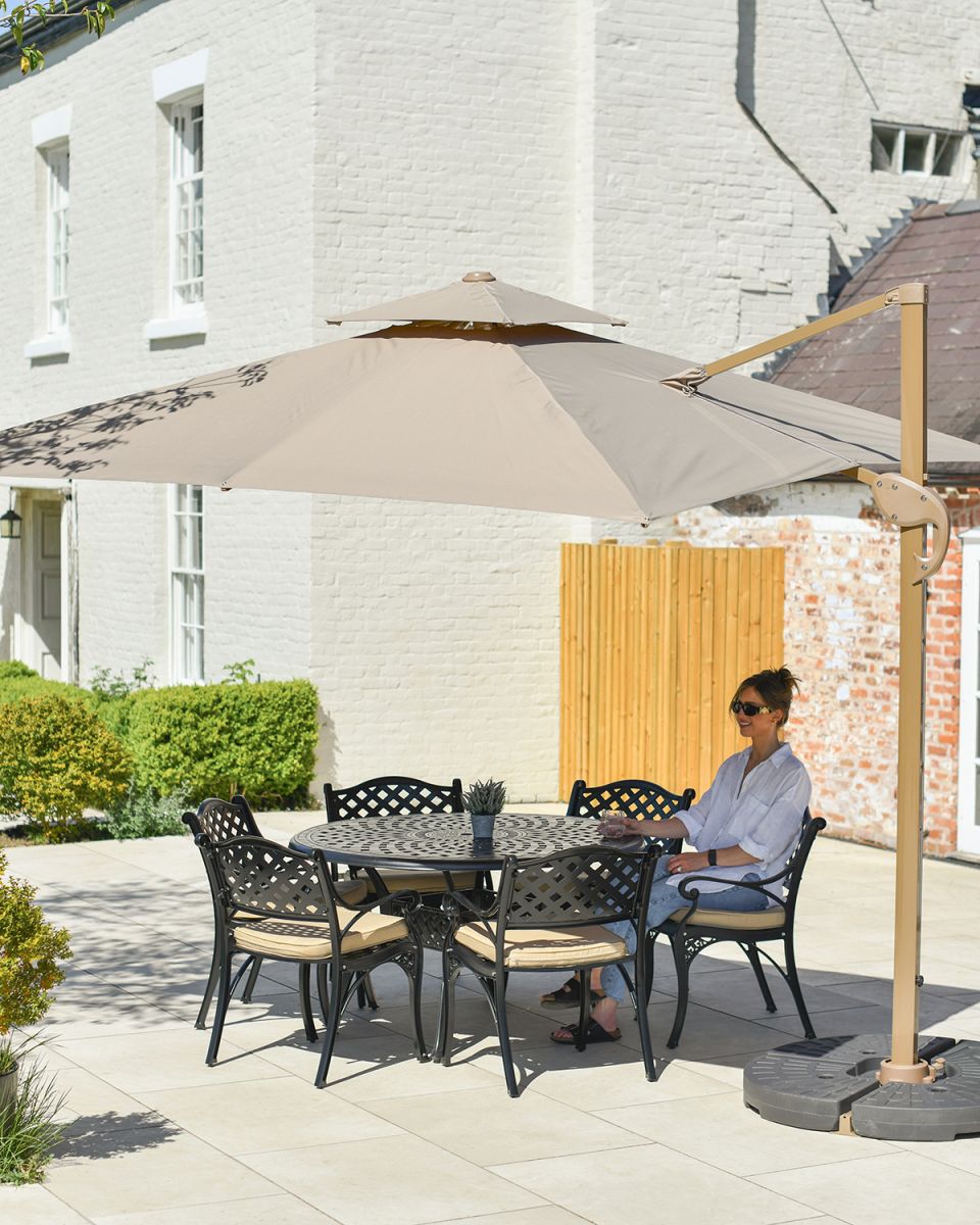 Outdoor Parasol Umbrella in Situ Outside in the Garden Covering a Dining Set