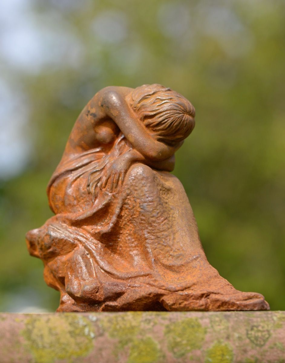 Cast Iron Resting Woman Statue