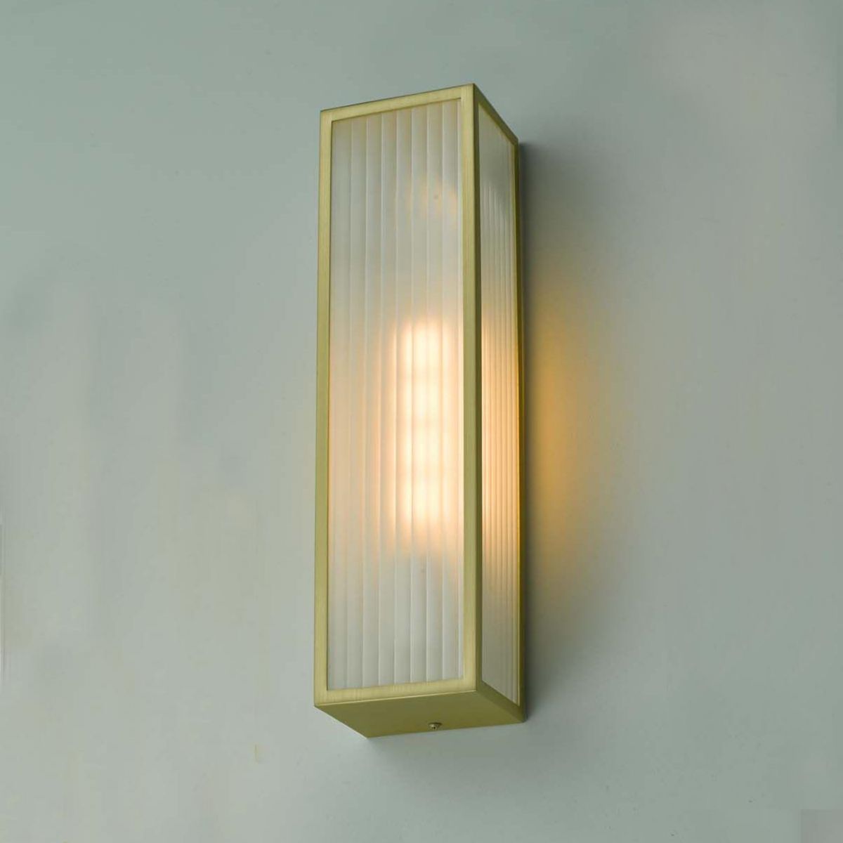 Polished Brass Reeded Glass Wall Light in Situ on a GReen Wall