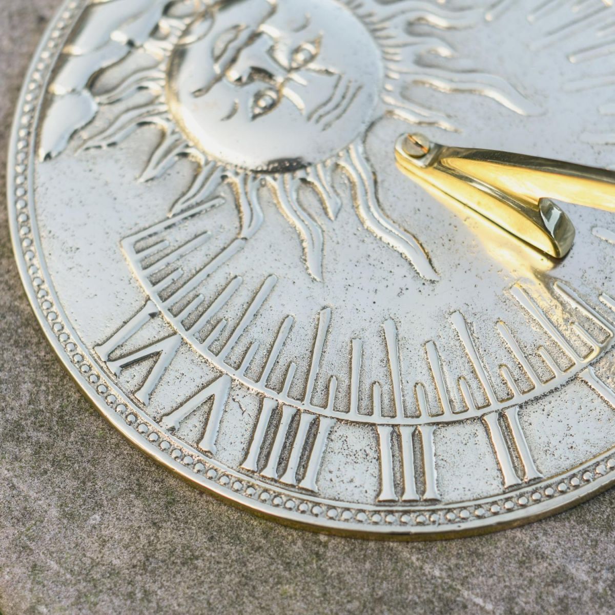 Close-Up of Roman Numeral Fixings on Polished Brass Finish