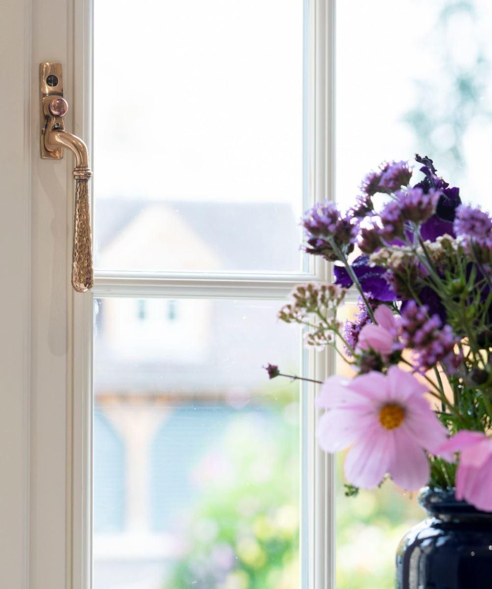Polished Copper Hammered Espag Window Handle - Right Handed in Situ