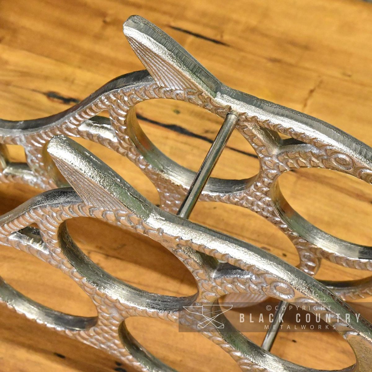 Top View of the Polished Nickel "Fish" Wine Rack 