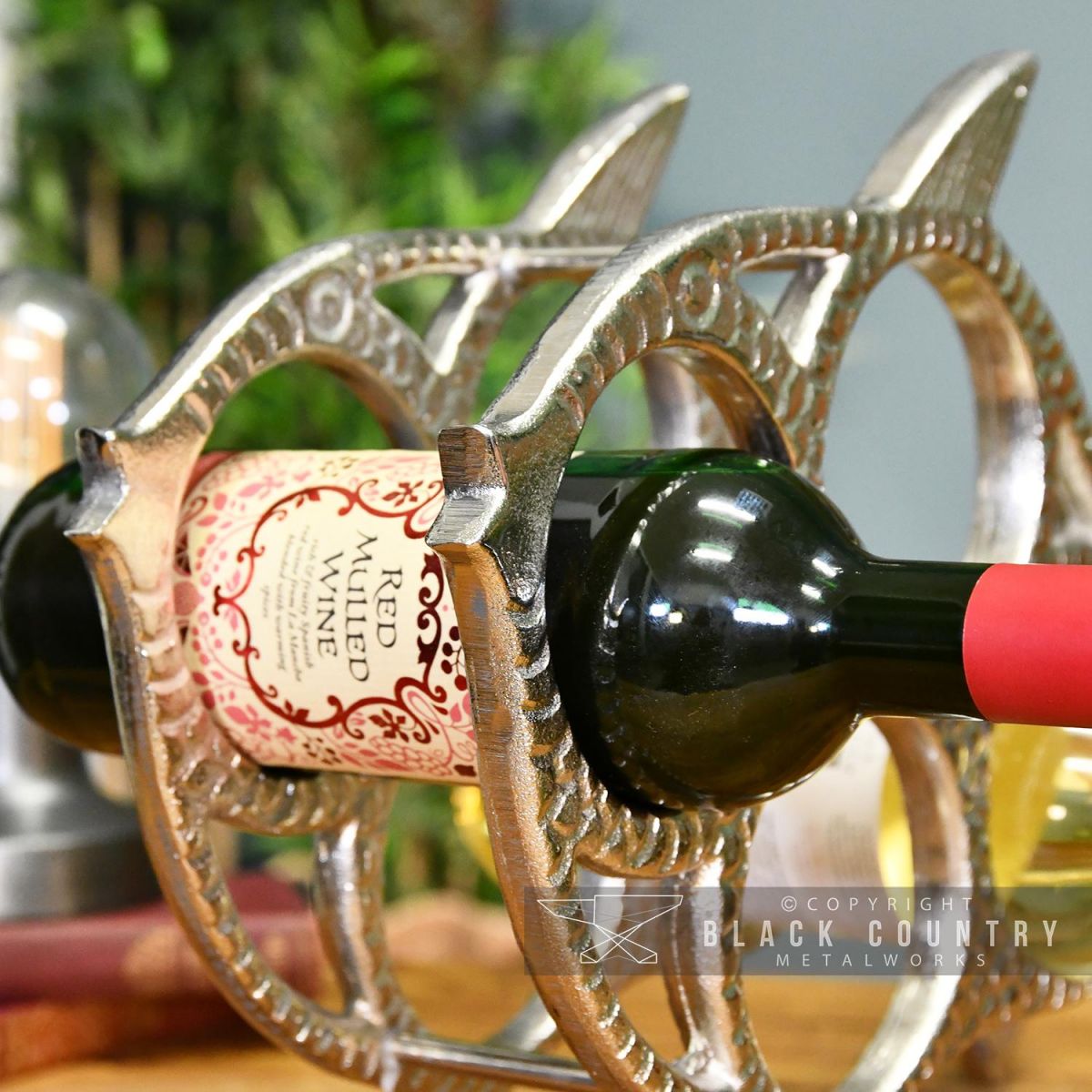 Side View of a Wine Bottle Being Held in the wine Rack