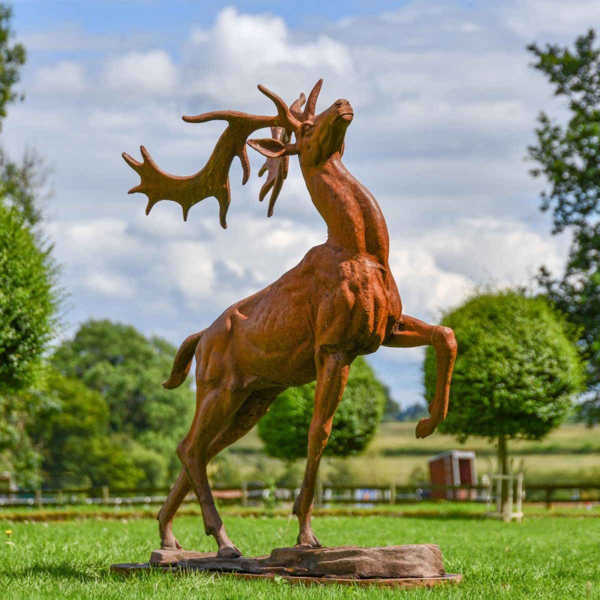 Proud Cast Iron Stag Garden Statue in situ in the Garden