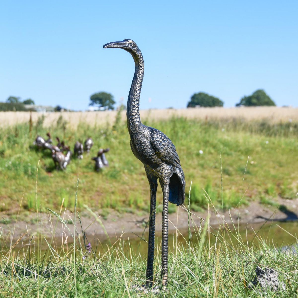 Recycled Cast Aluminium Brushed Gold Goliath Heron Sculpture in Situ