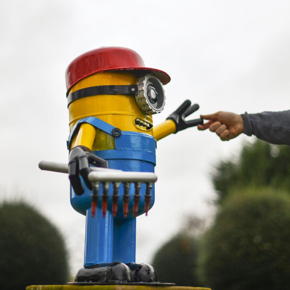 Scale Shot of Recycled Metal "Giddy Gardener" Henchman Sculpture