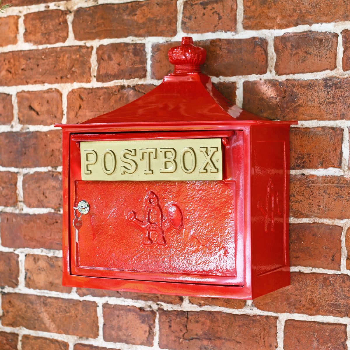 Red "The Suffolk" Post Box in Situ on a Brick Wall