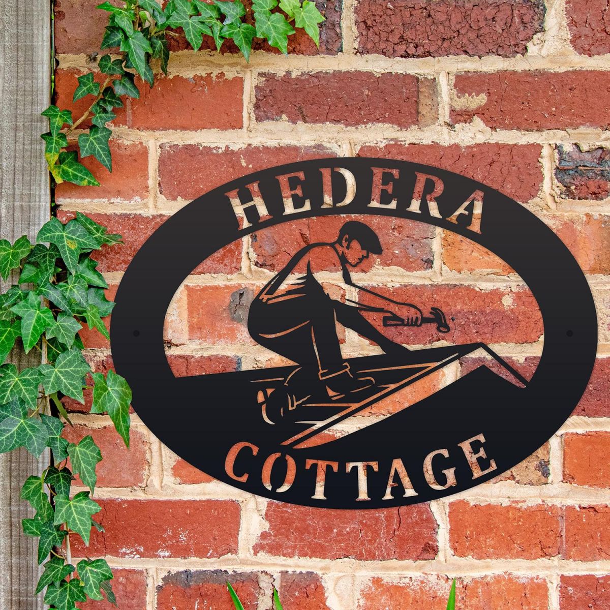 Roofer Iron Oval House Sign on a Brick Wall