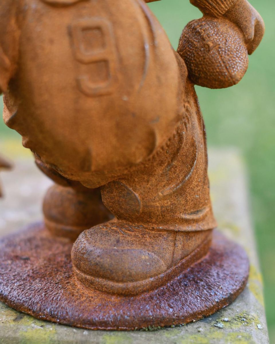 Close-Up of Freestanding Base on Cast Iron Pig Sculpture