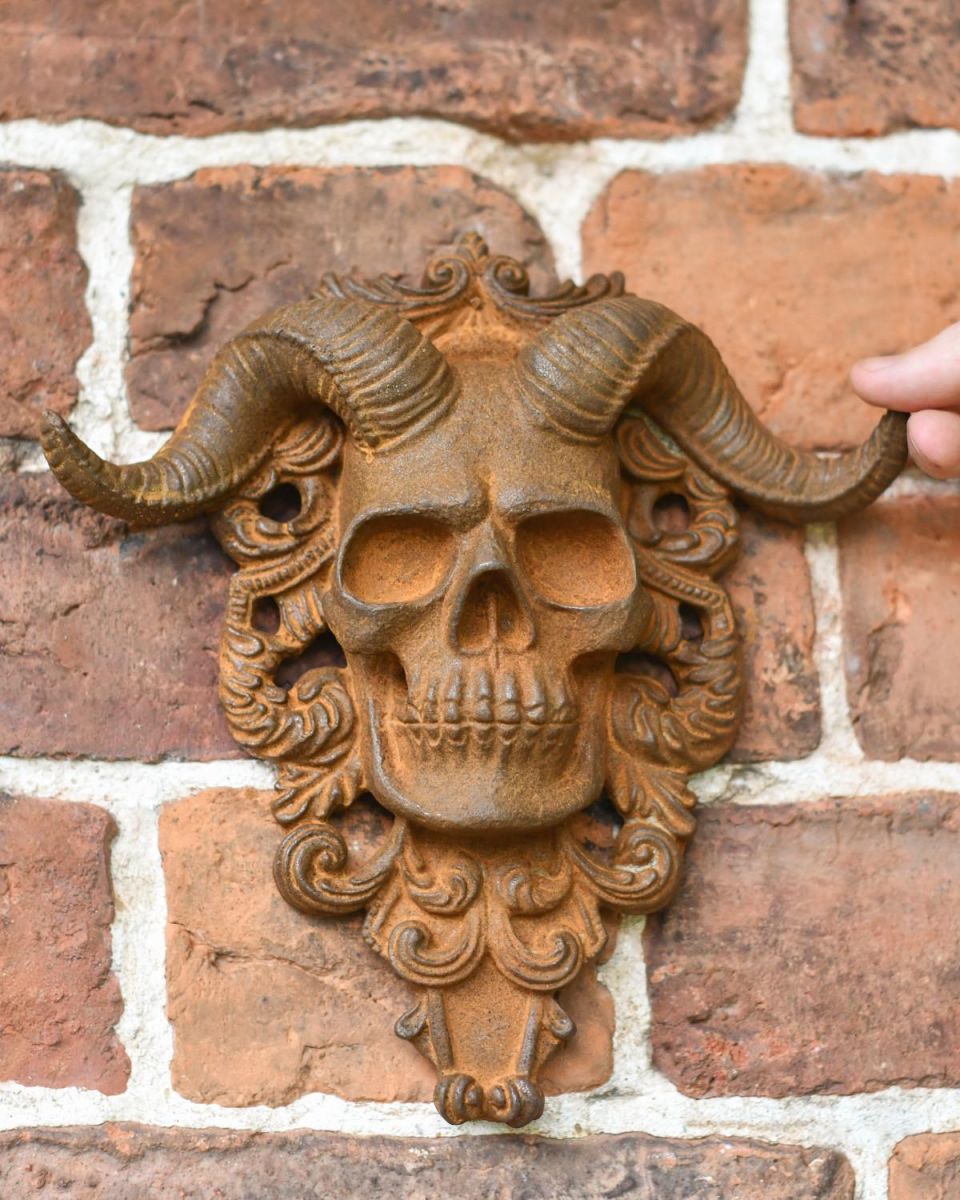 Scale Shot of Rustic Cast Iron "El Diablo" Exterior Wall Art