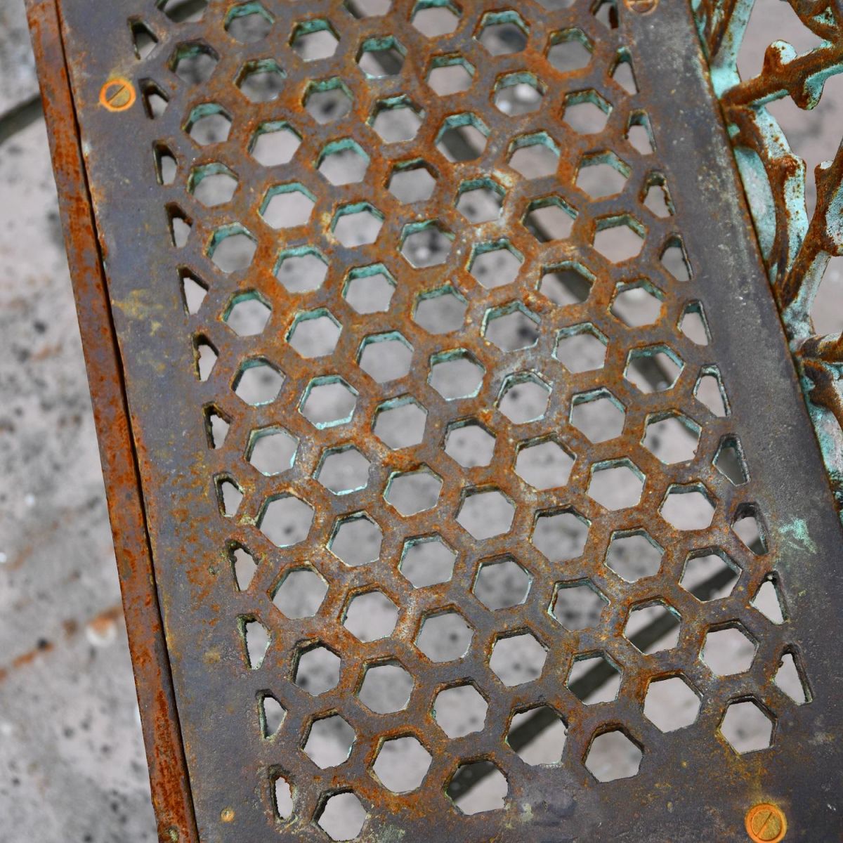 Close up of honeycomb design on rustic three seater garden bench seat