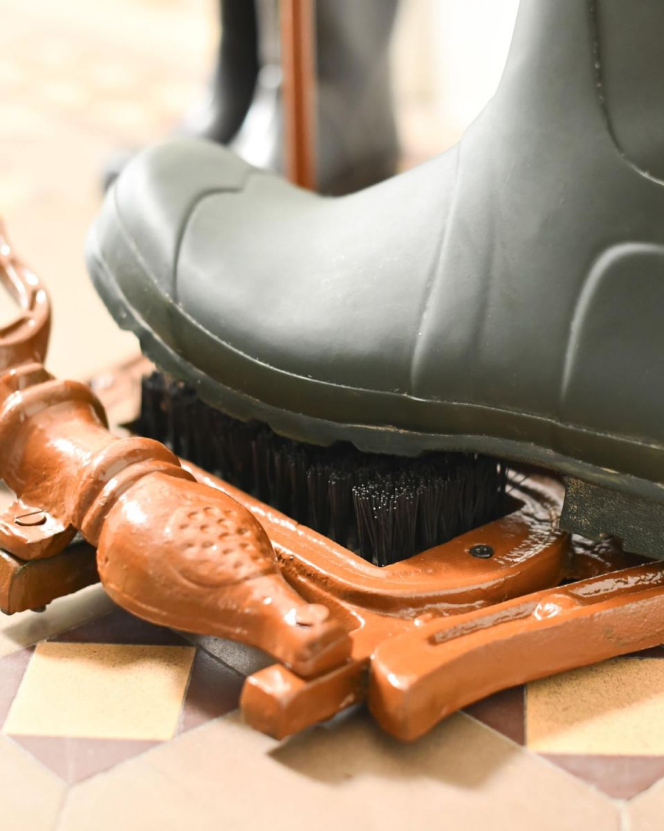 Scale Shot of Rustic Two-in-One Horse Head Boot Scraper & Wellie Rack