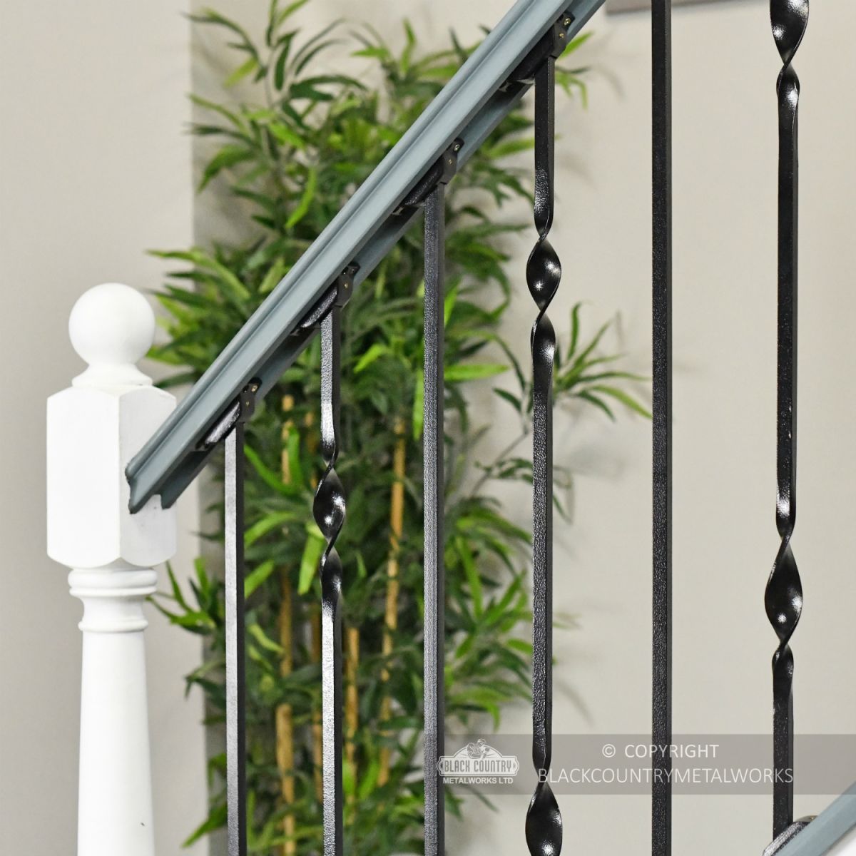 Black Iron Stair Spindle Sets Installed In Modern Staircase