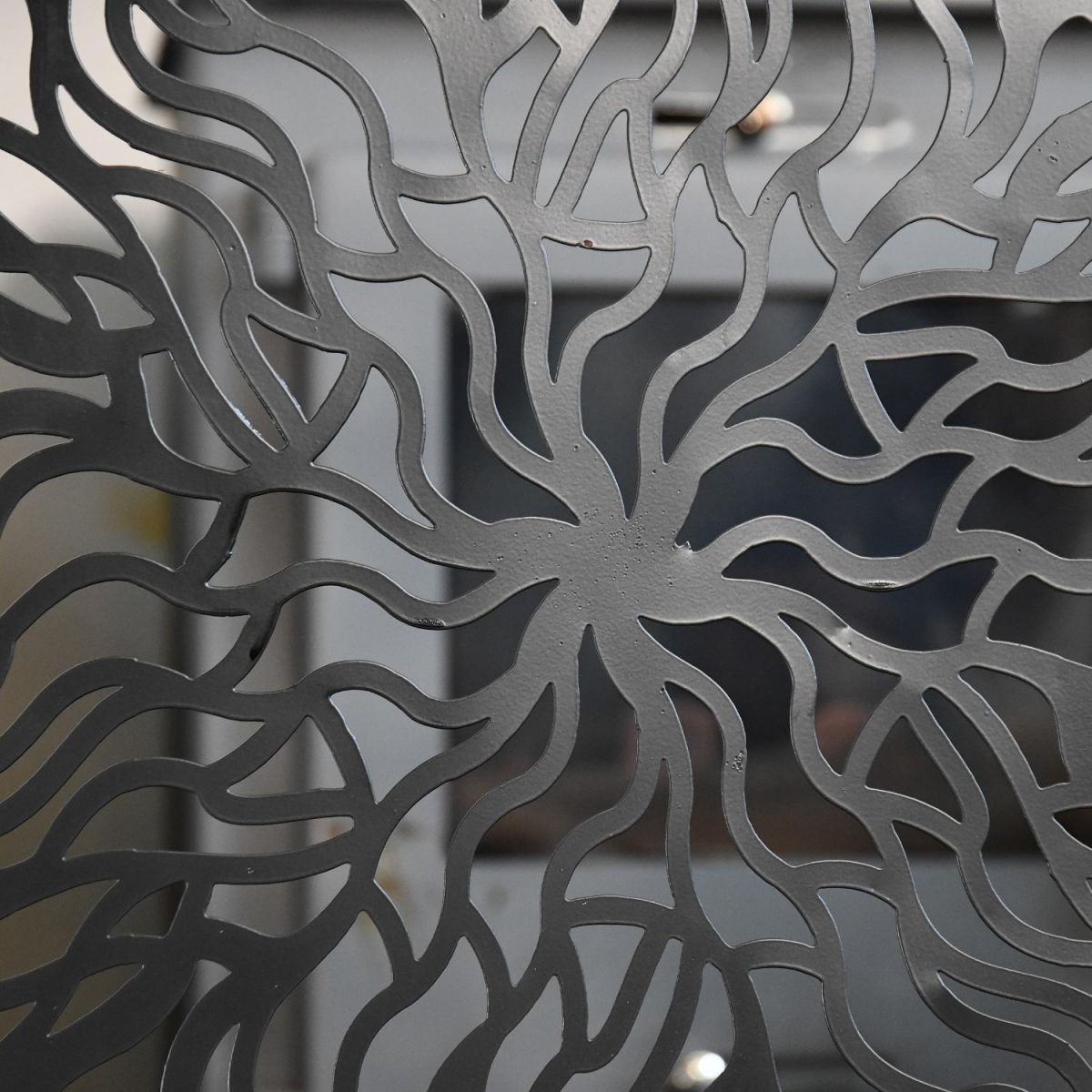 Close up of metal and black finish aurora designClose up of metal and black finish aurora design