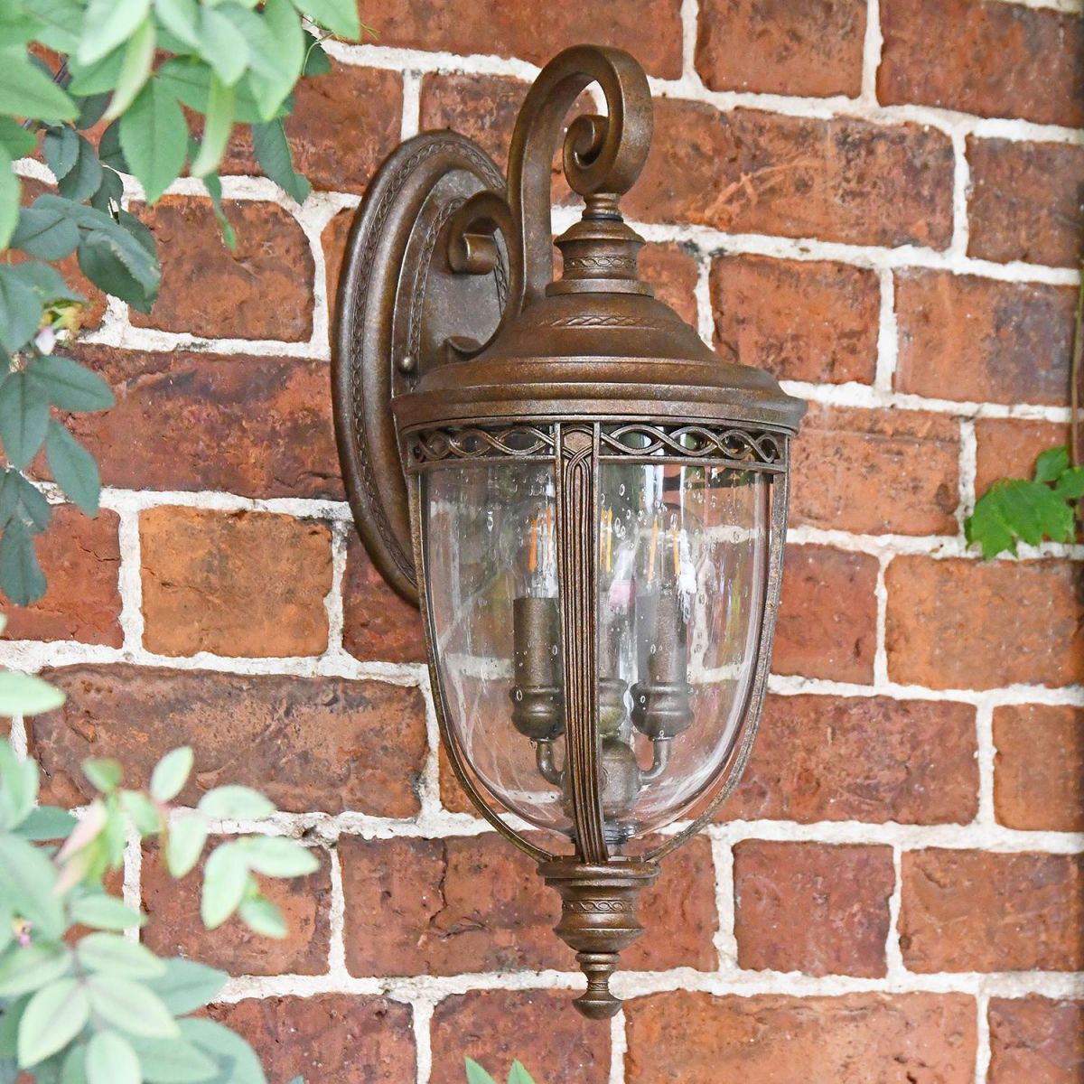 Traditional Top Fix Bronze Wall Lantern in Situ on a Brick Wall
