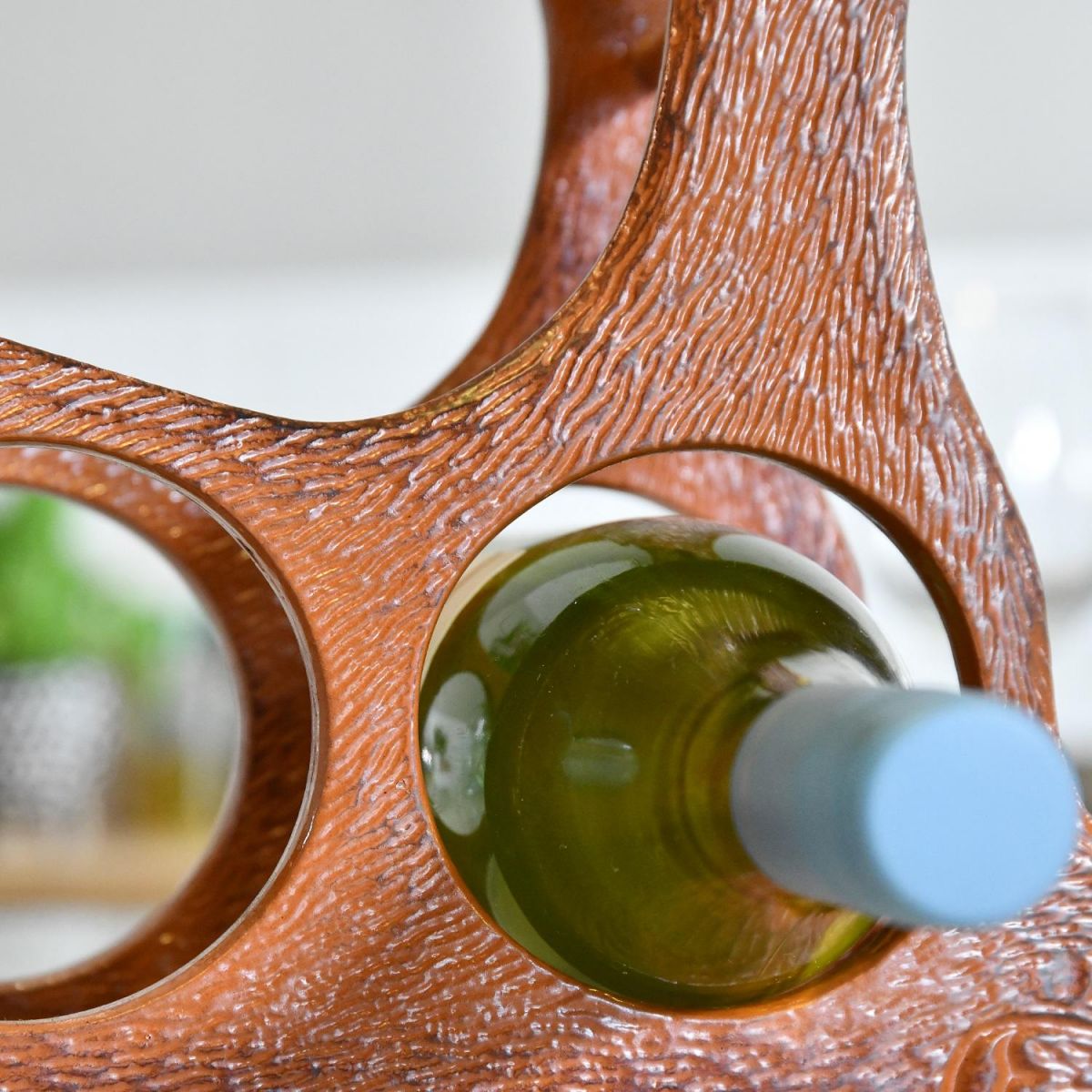 Close up of circular wine bottle holder within Rustic "Laying Stag" 