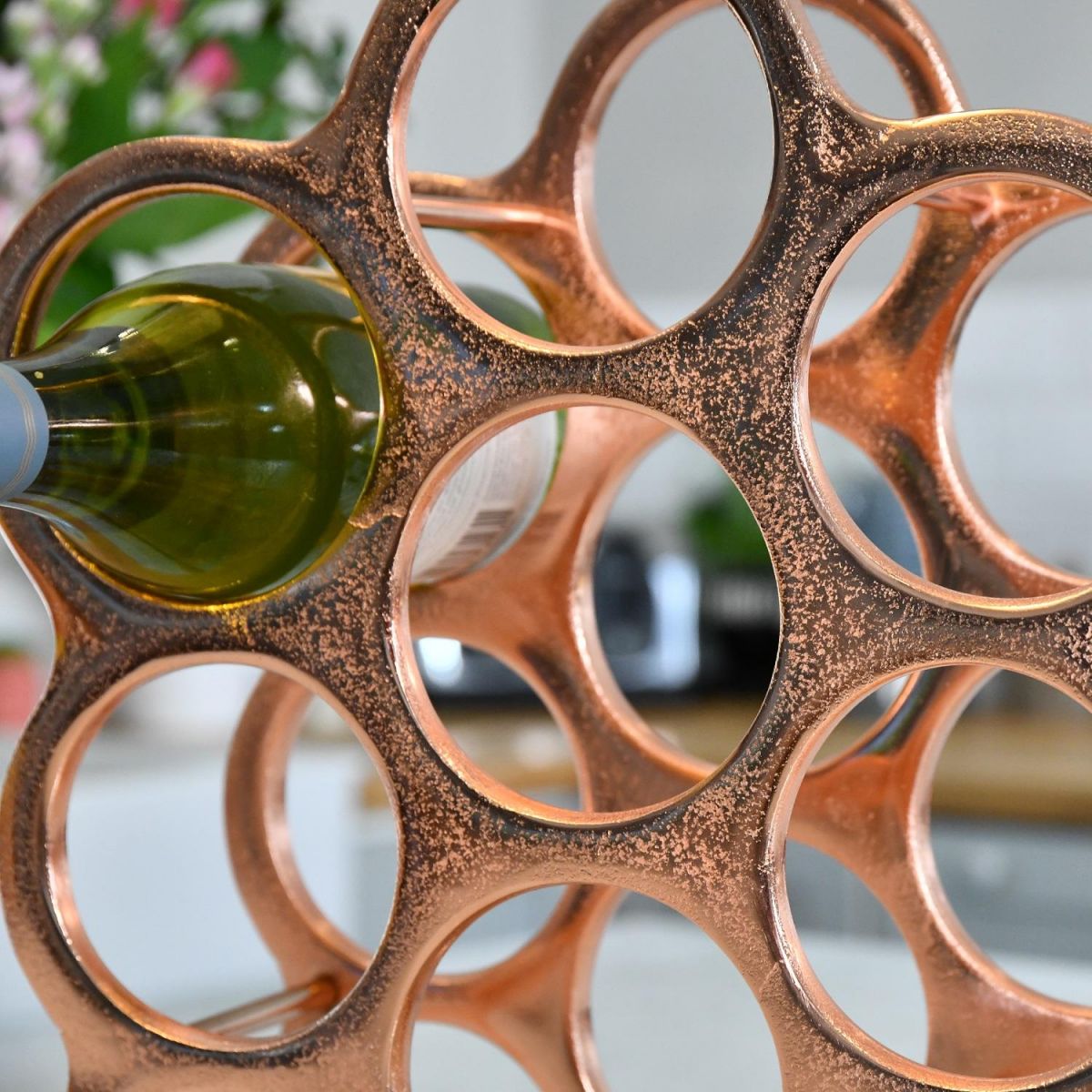 Close up of circular bottle holders in kitchen setting 