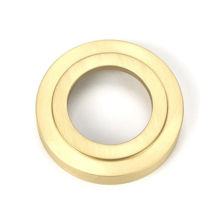 Close-Up of Backplate for Satin Brass "Royale" Art-Deco Concealed Door Handle on Rose Set