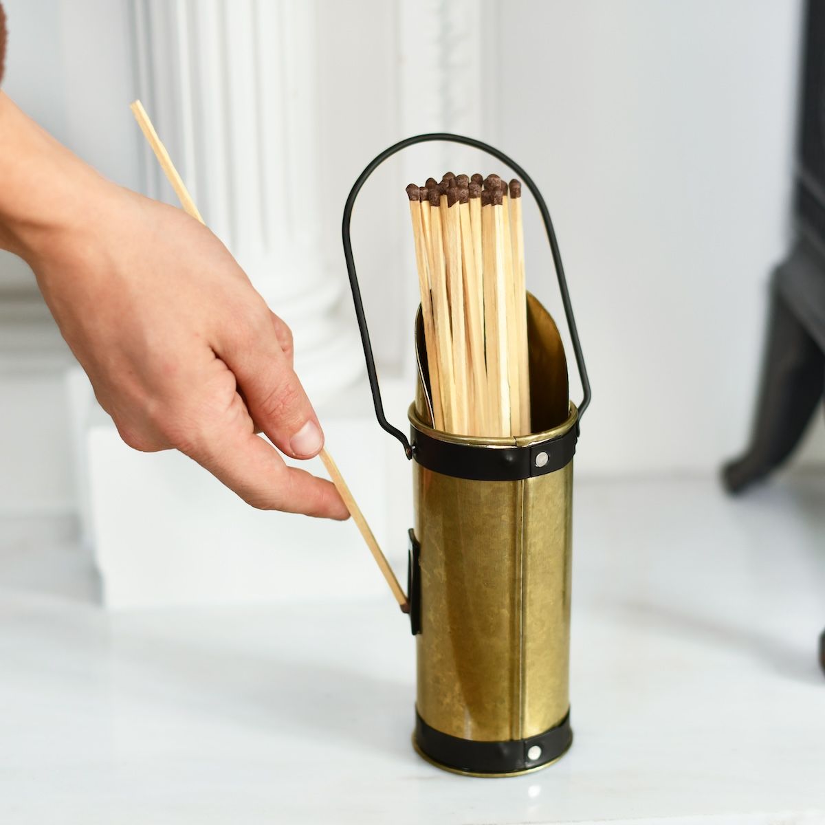 Scale image of bronze match stick holder