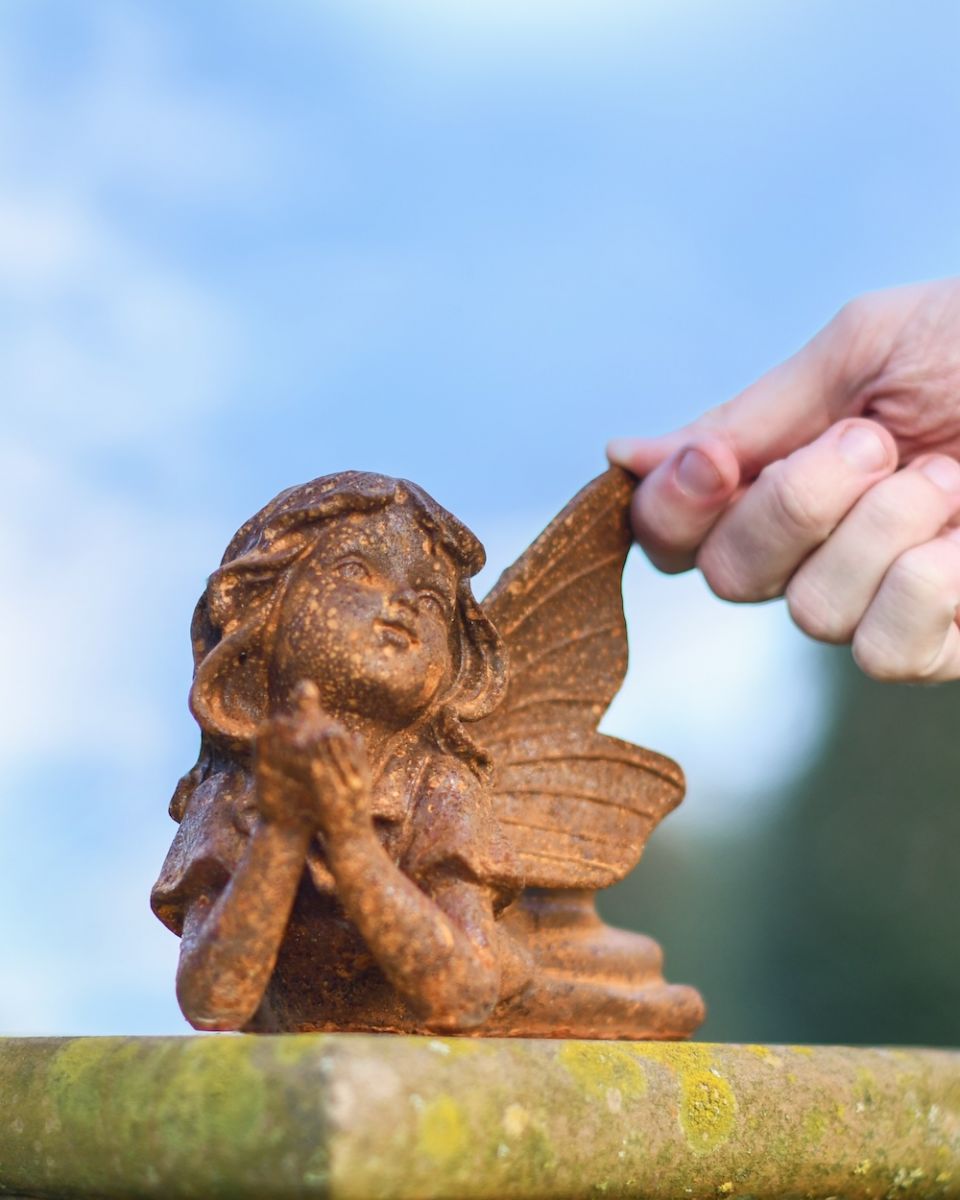 Scale image of rustic finish cast iron garden sculpture