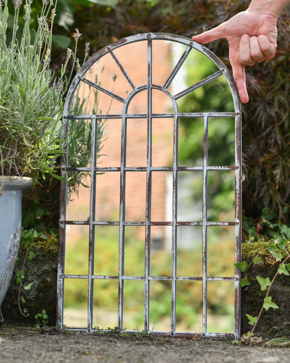 Scale image of metal garden mirror