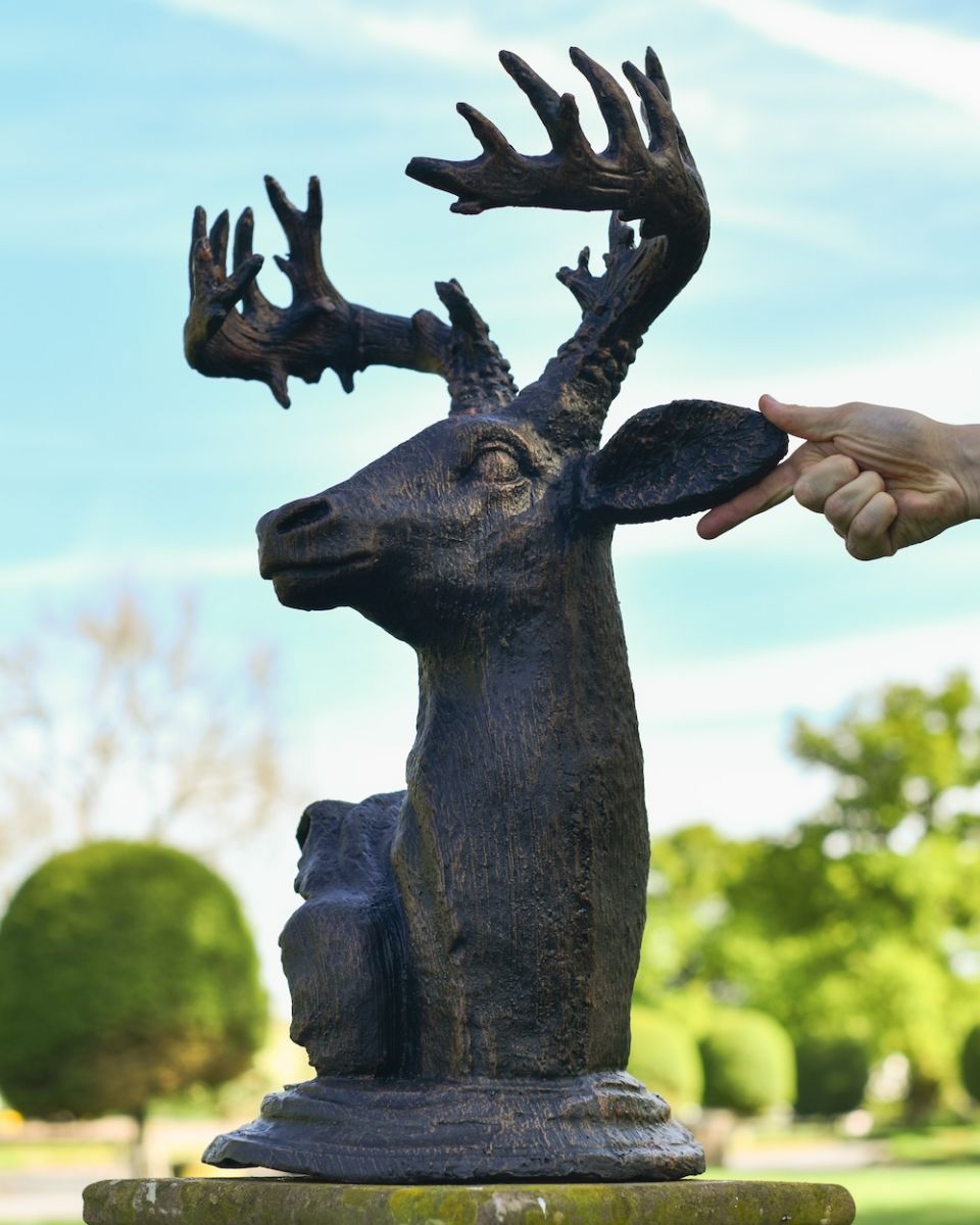 scale image of antique bronze garden statue